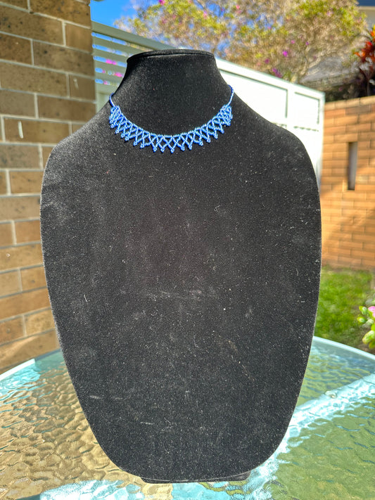 Intricate woven blue beaded necklace