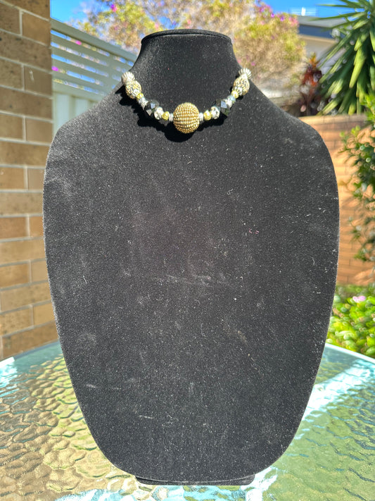 Multi-size beaded silver,gold and black necklace